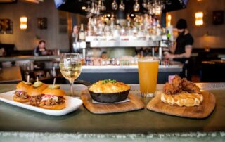 A bar loaded with mouthwatering dishes, sliders, and refreshing drinks that make The Pioneer BBQ a favorite in Eastlake.